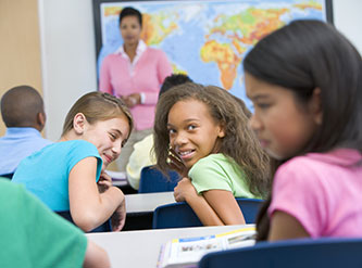 Children bully a young girl in class